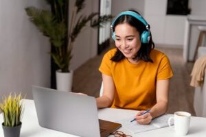 Digital-Marketing-Virtual-Assistants-collaborating-via-laptop-and-headset-in-a-clean-office-space